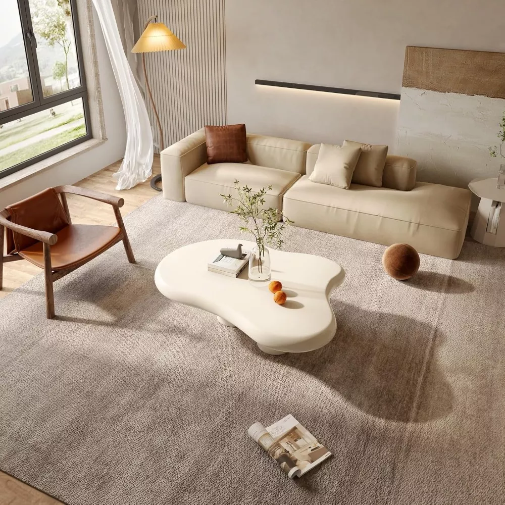 Milky white sculptural table in a cozy modern living room