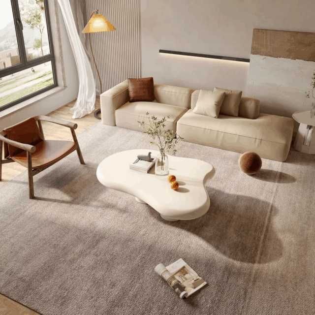 Modern Cloud Coffee Table in milky white with organic curved shape in living room setting