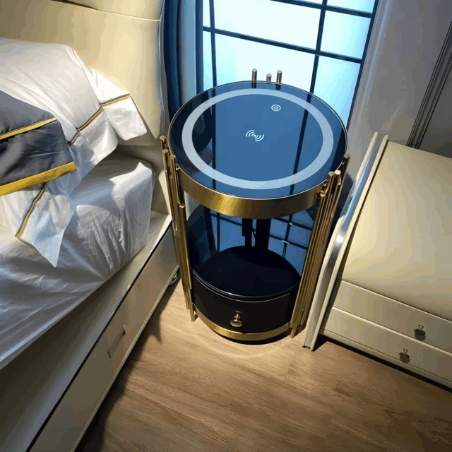 Close-up of Nordic round smart nightstand with wireless charging pad, gold frame, and touch control button.
